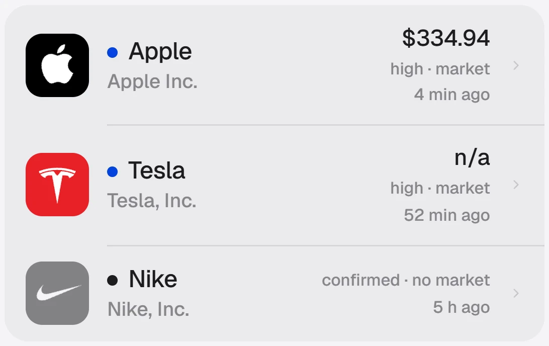 Three scans in the log: Apple and Tesla resolved to a market, Nike recorded as confirmed with no market.